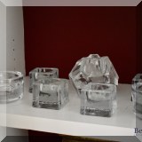 G03. Glass candleholders. 